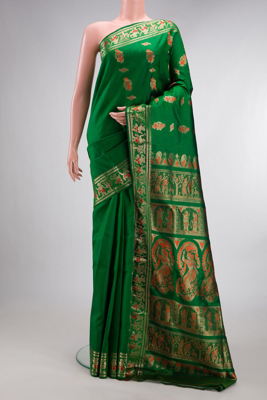 Pure Silk Green Baluchari Saree with Zari And Thread Butta on the body and Fancy Border.  displayed on a mannequin