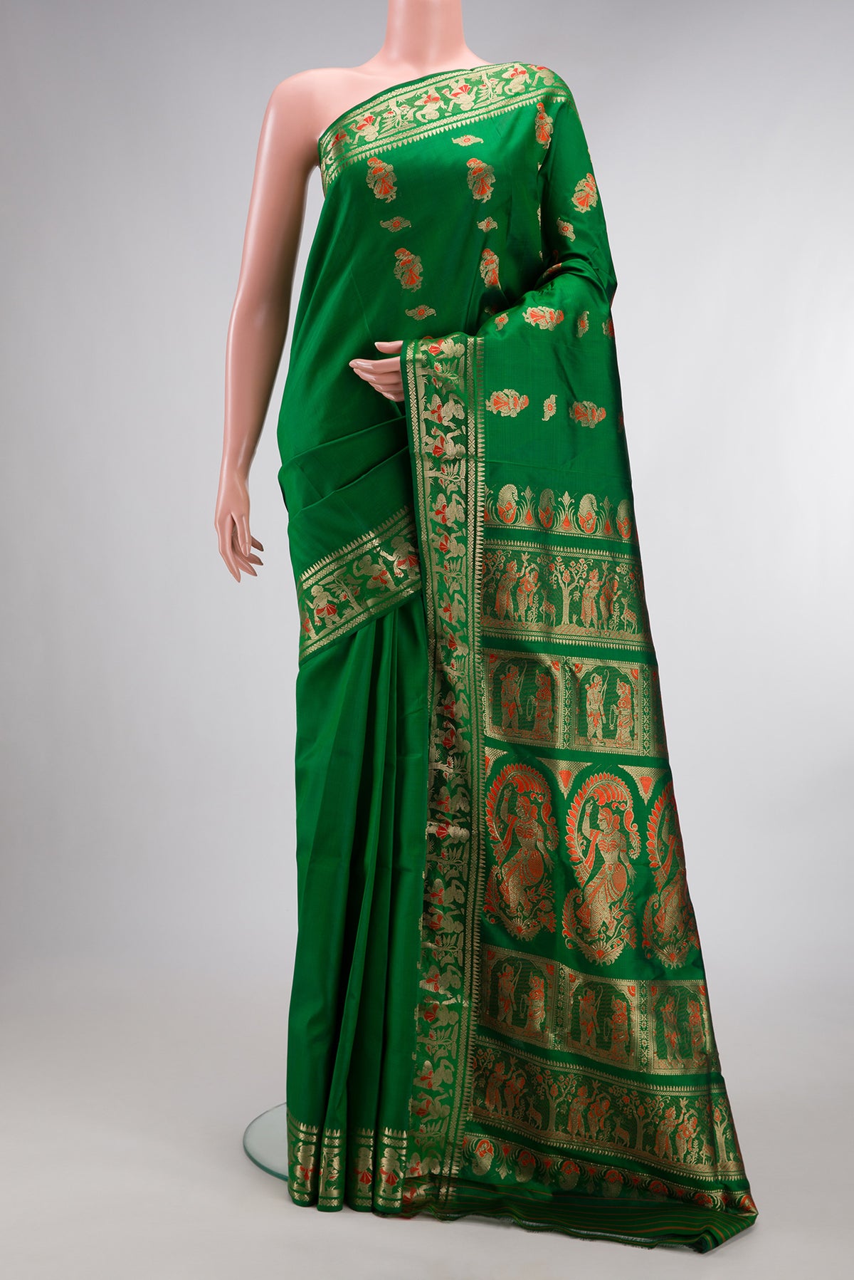 Pure Silk Green Baluchari Saree with Zari And Thread Butta on the body and Fancy Border.  displayed on a mannequin