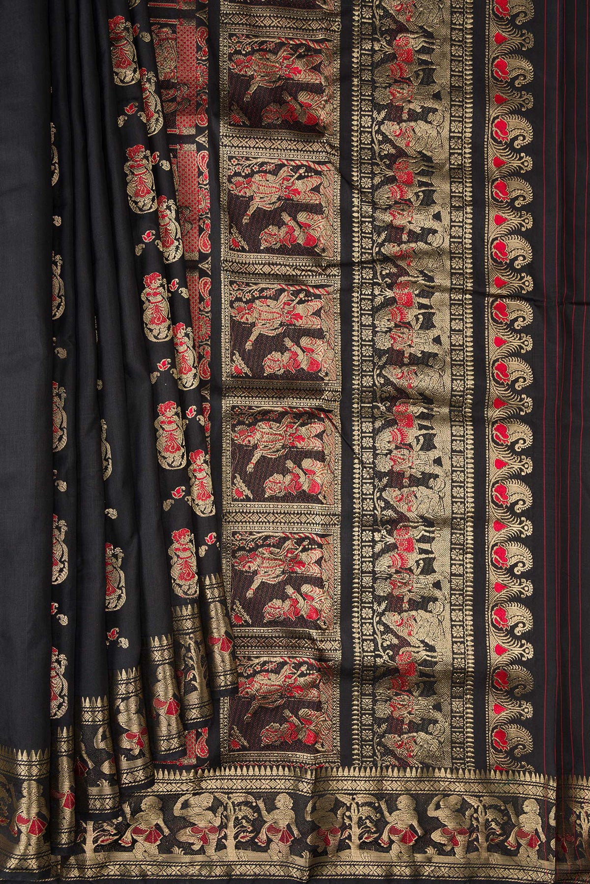Pleats and pallu of Pure Silk Black Baluchari Saree with Zari And Thread Butta on the body and Fancy Border. 