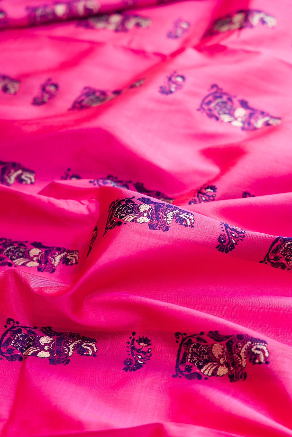 Close up of Pure Silk Pink Baluchari Saree with Thread Butta on the body and Thread Border.  displaying folds