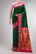 Pure Silk Bottle Green Paithani Saree with Zari Butta on the body and Zari Border.  displayed on a mannequin