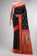 Pure Silk Black Dual Tone Paithani Saree with Zari And Thread Butta on the body and Zari Border.  displayed on a mannequin