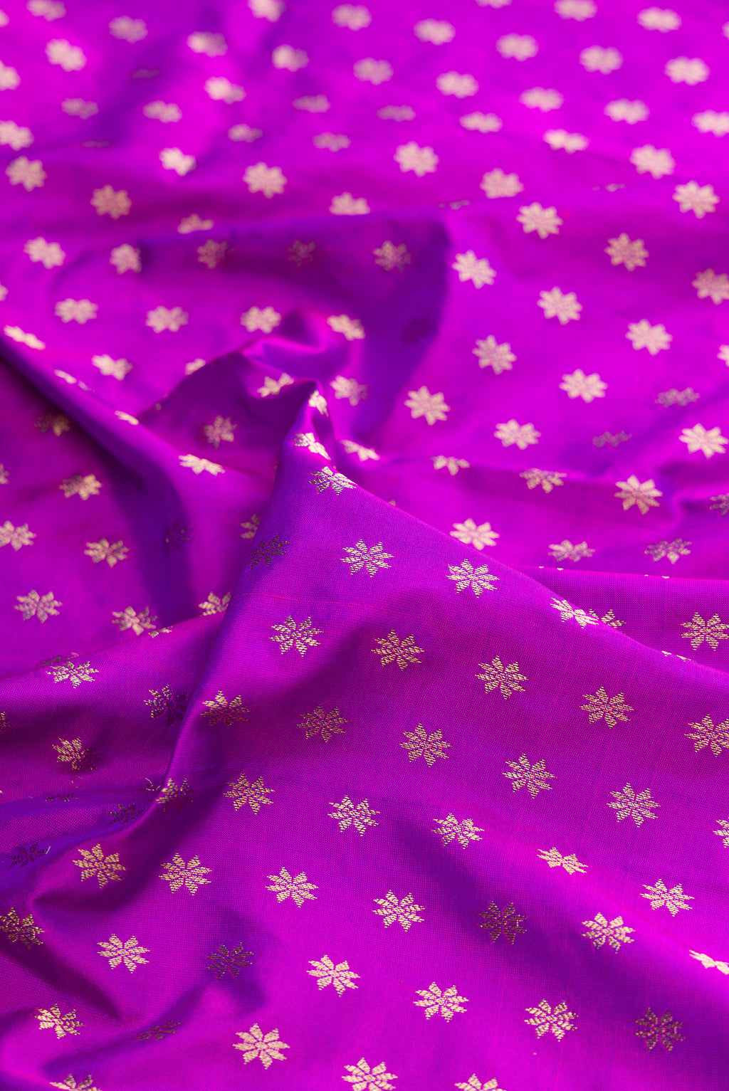 Close up of Pure Silk Purple Paithani Saree with Zari Butta on the body and Zari Border.  displaying folds