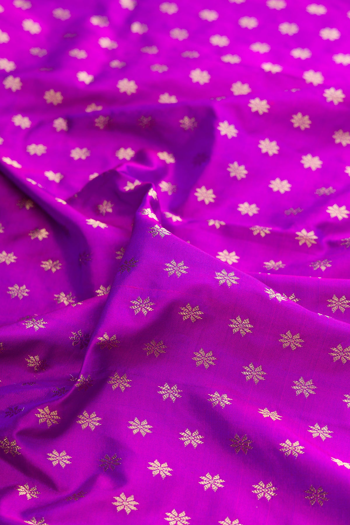 Close up of Pure Silk Purple Paithani Saree with Zari Butta on the body and Zari Border.  displaying folds