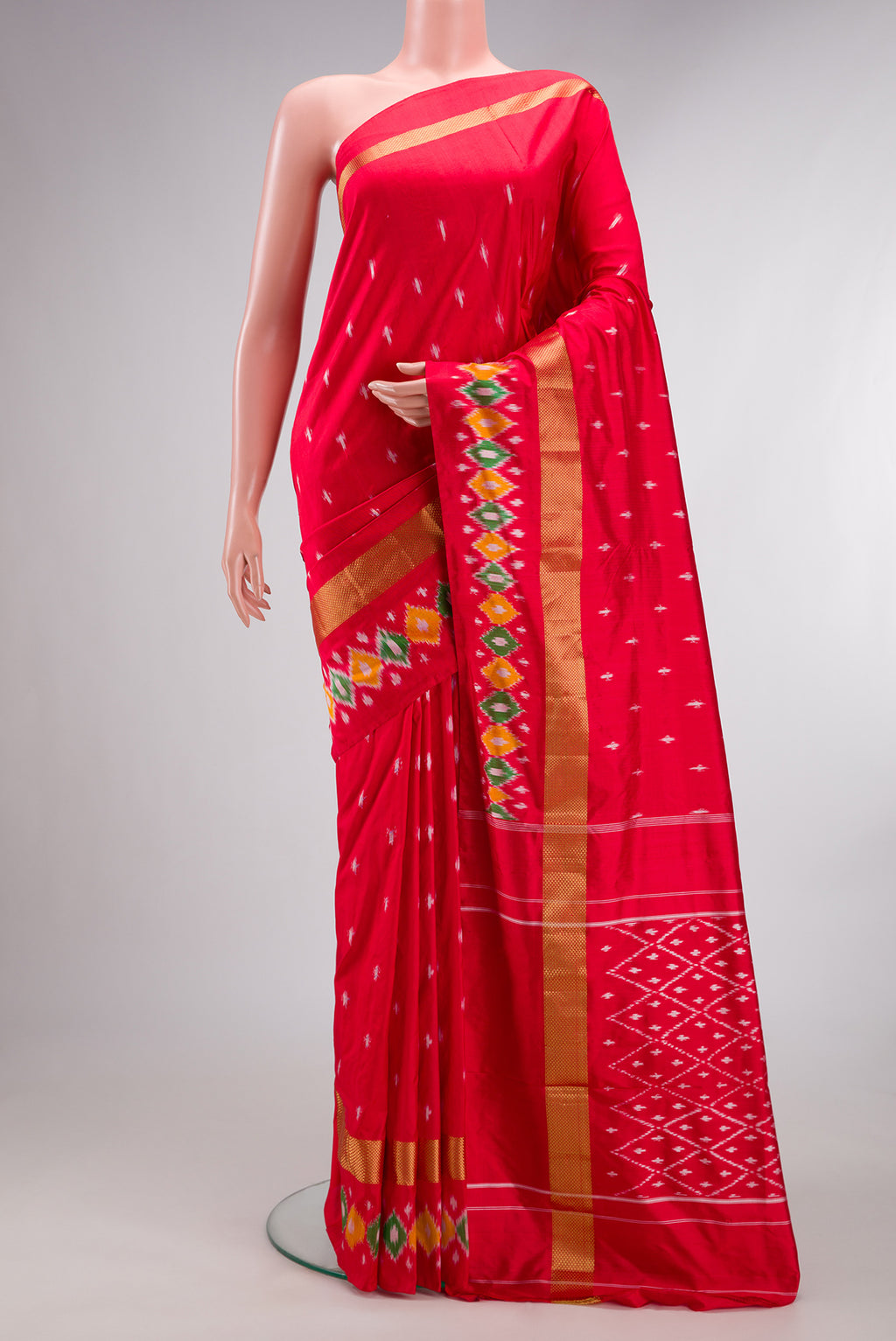 Pure Silk Red Pochampally Saree with Ikat design on the body and Ikat Border.  displayed on a mannequin