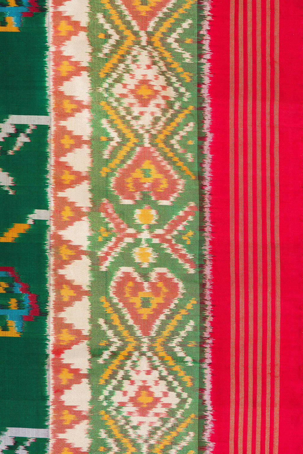 Border image of Pure Silk Bottle Green Dual Tone Double Ikat Saree with Ikat Print on the body and Ikat Border. 