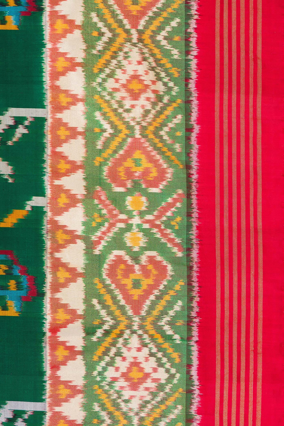 Border image of Pure Silk Bottle Green Dual Tone Double Ikat Saree with Ikat Print on the body and Ikat Border. 