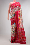Pure Silk Off White Pochampally Saree with Pure Ikat on the body and Ikat Border.  displayed on a mannequin