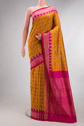 Pure Silk Mustard Pochampally Saree with Pure Ikat on the body and Ikat Border.  displayed on a mannequin