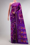 Pure Silk Purple Pochampally Saree with Pure Ikat on the body and Ikat Border.  displayed on a mannequin