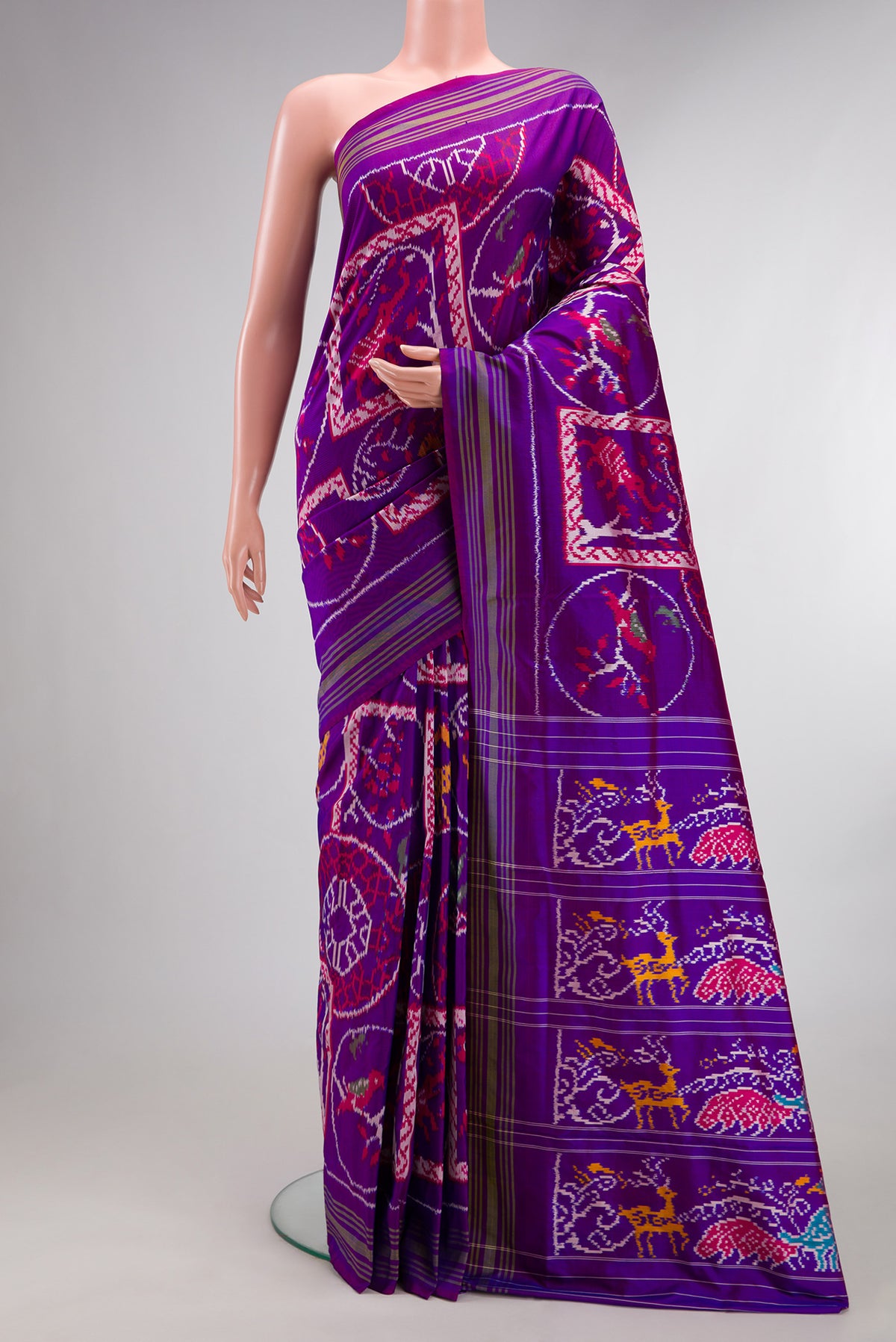 Pure Silk Purple Pochampally Saree with Pure Ikat on the body and Ikat Border.  displayed on a mannequin