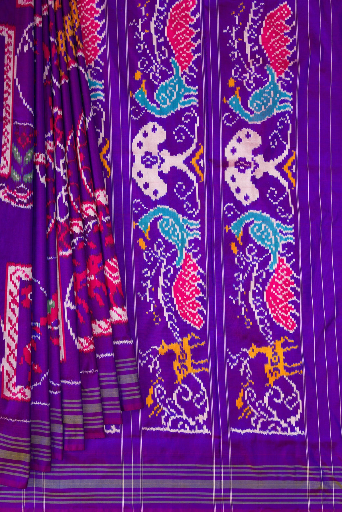 Pleats and pallu of Pure Silk Purple Pochampally Saree with Pure Ikat on the body and Ikat Border. 