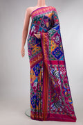 Pure Silk Multi Color Pochampally Saree with Pure Ikat on the body and Ikat Border.  displayed on a mannequin