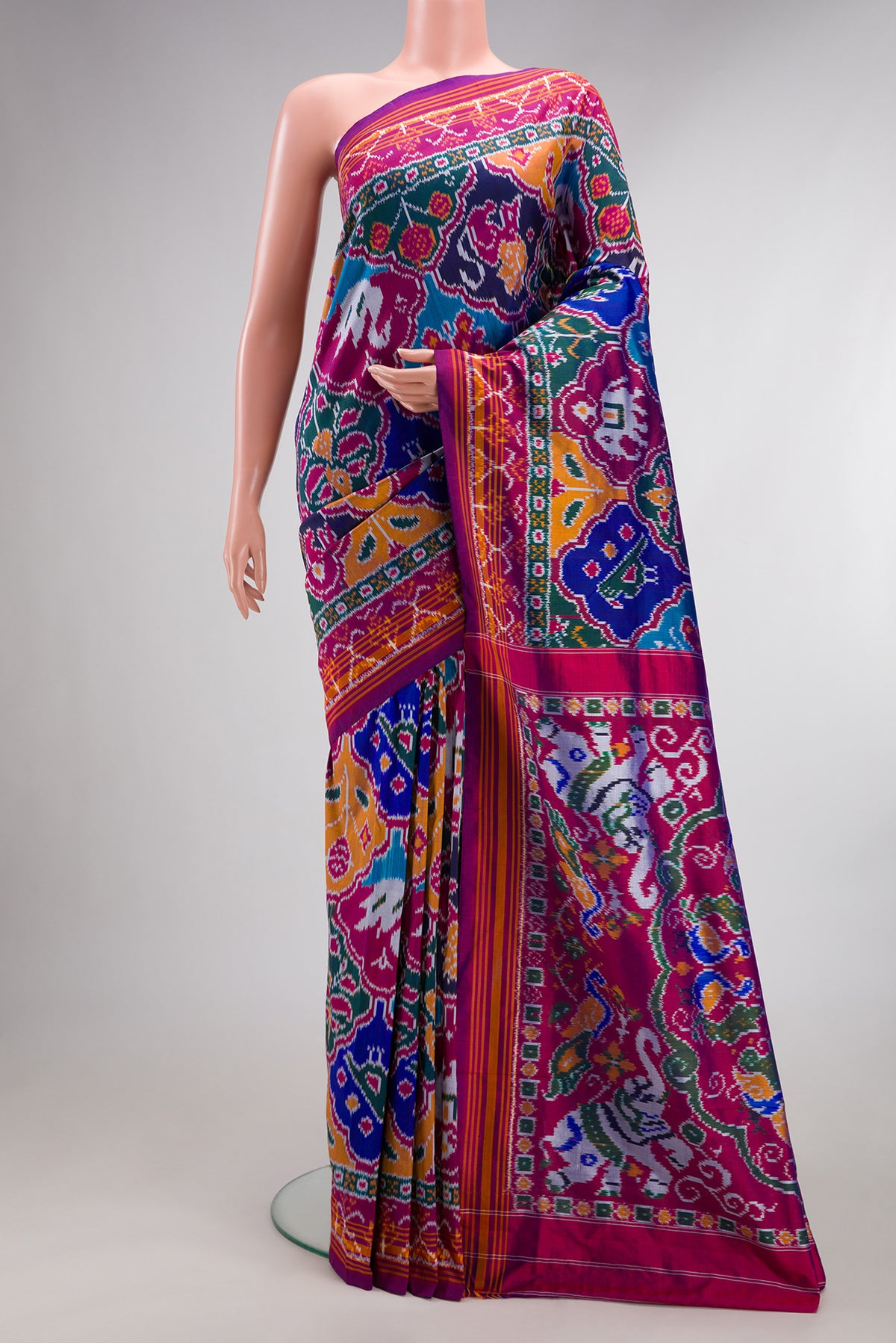Pure Silk Multi Color Pochampally Saree with Pure Ikat on the body and Ikat Border.  displayed on a mannequin