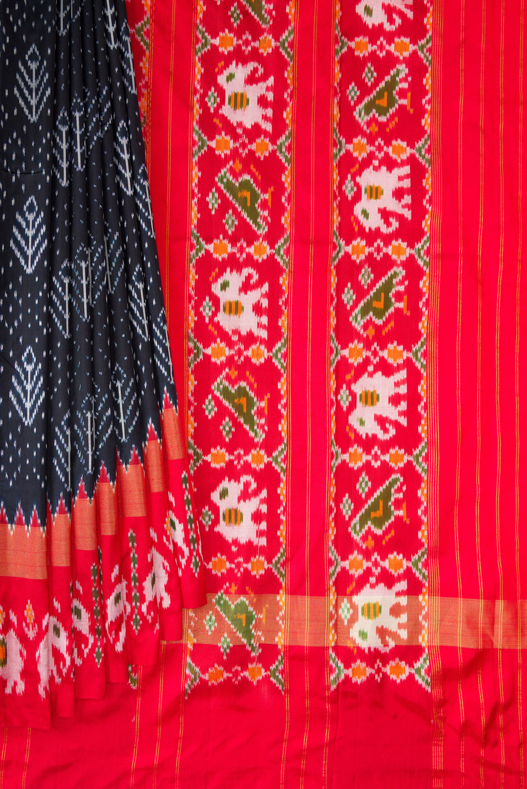 Pleats and pallu of Pure Silk Navy Blue Dual Tone Double Ikat Saree with Ikat Print on the body and Ikat Border. 