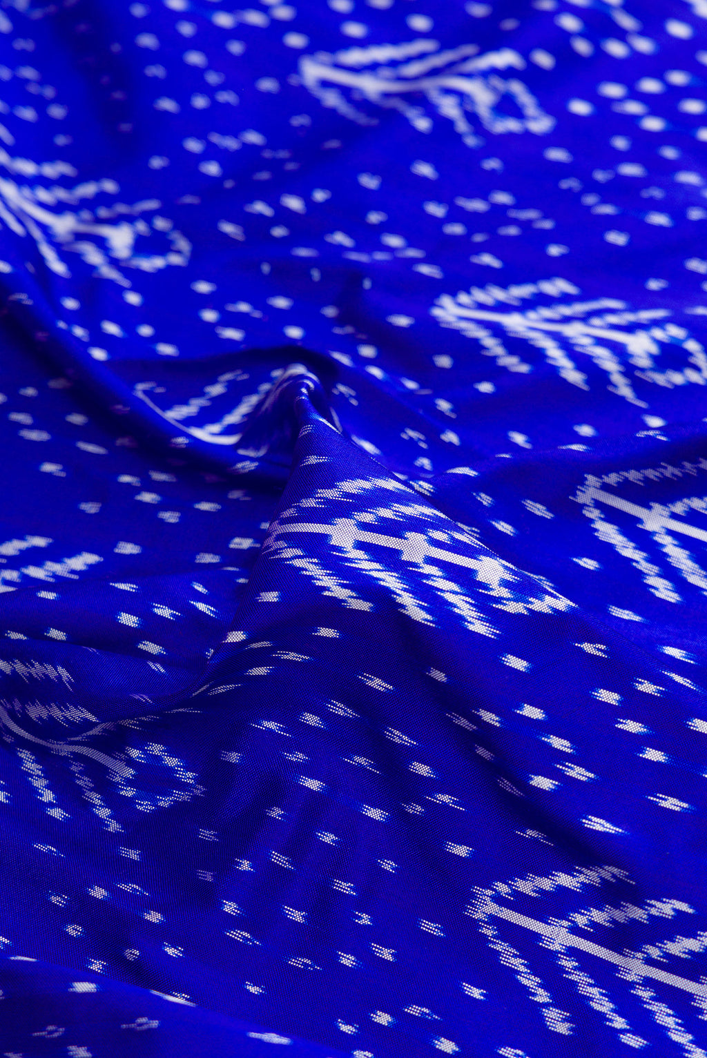 Close up of Pure Silk Royal Blue Pochampally Saree with Pure Ikat on the body and Ikat Border.  displaying folds