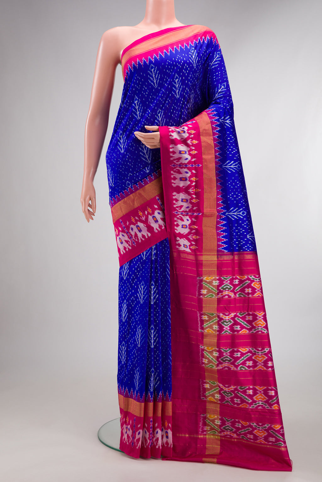 Pure Silk Royal Blue Pochampally Saree with Pure Ikat on the body and Ikat Border.  displayed on a mannequin