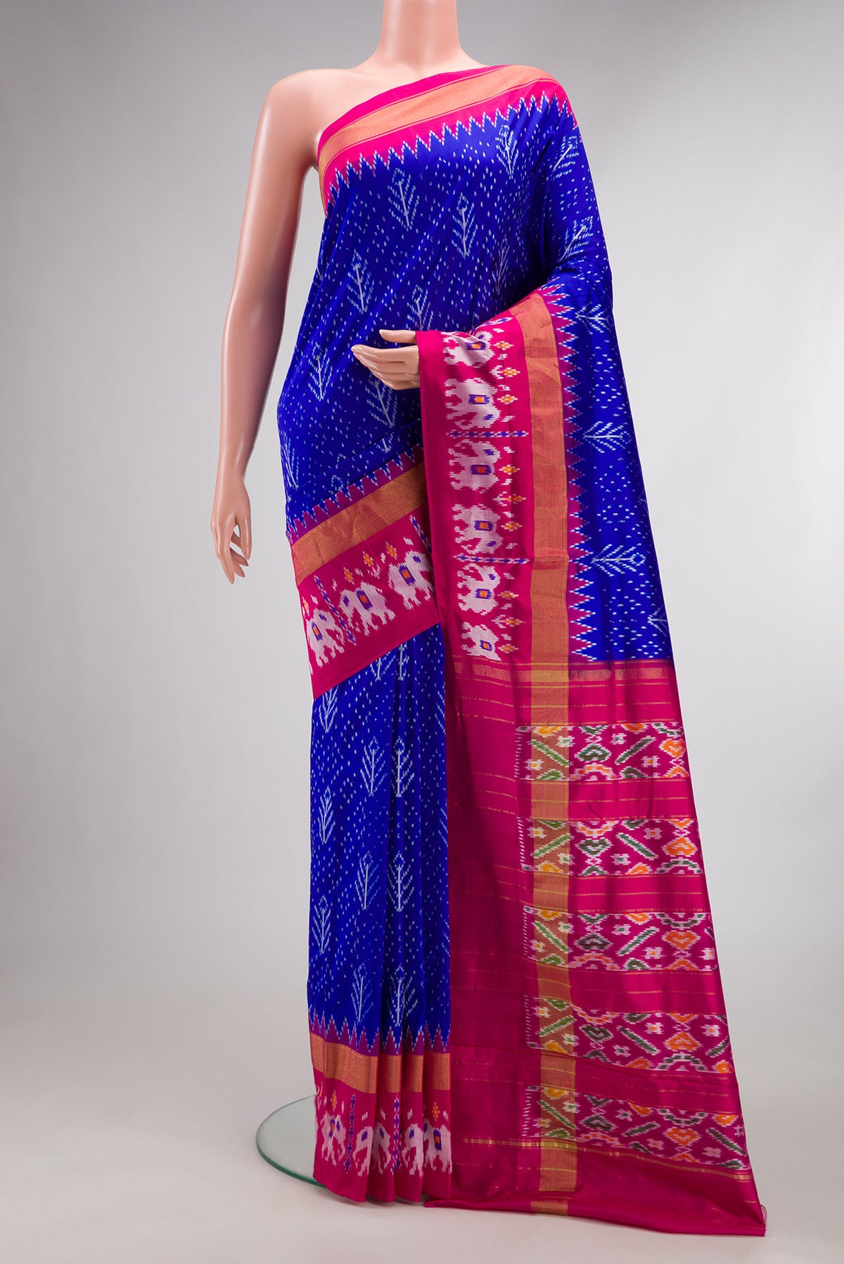 Pure Silk Royal Blue Pochampally Saree with Pure Ikat on the body and Ikat Border.  displayed on a mannequin