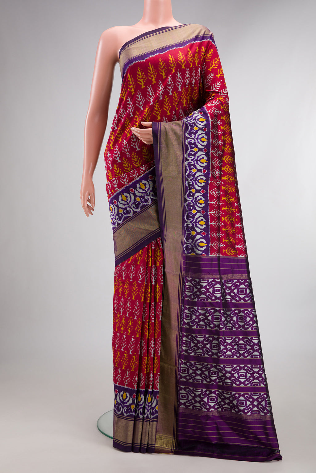 Pure Silk Deep Red Pochampally Saree with Pure Ikat on the body and Ikat Border.  displayed on a mannequin