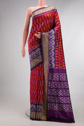 Pure Silk Deep Red Pochampally Saree with Pure Ikat on the body and Ikat Border.  displayed on a mannequin