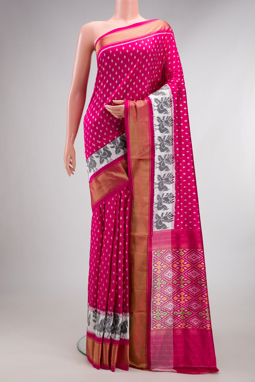 Pure Silk Dark Pink Pochampally Saree with Pure Ikat on the body and Ikat Border.  displayed on a mannequin
