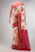 Pure Silk Off White Pochampally Saree with Pure Ikat on the body and Zari Border.  displayed on a mannequin