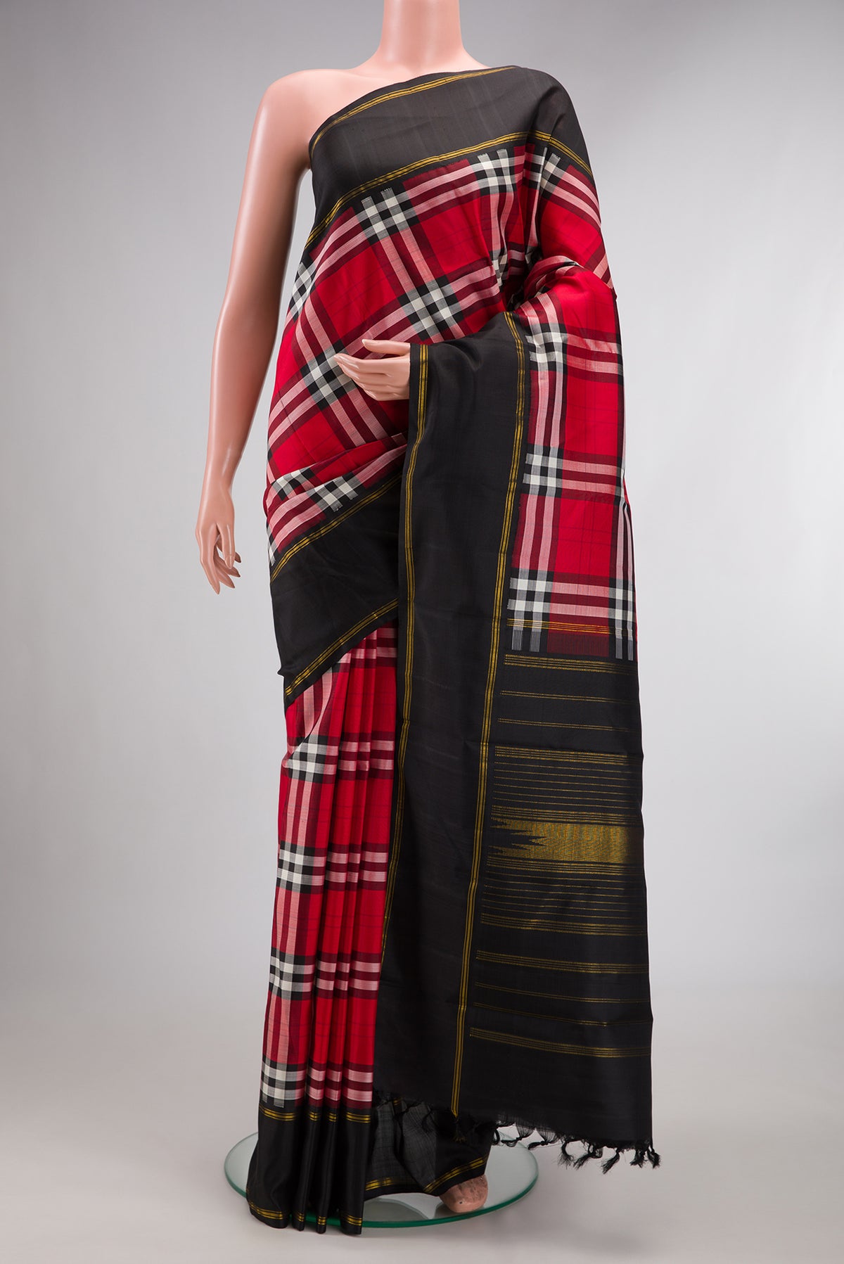 Pure Silk Multi Color Kanjivaram Saree with Checked design on the body and Plain Border.  displayed on a mannequin