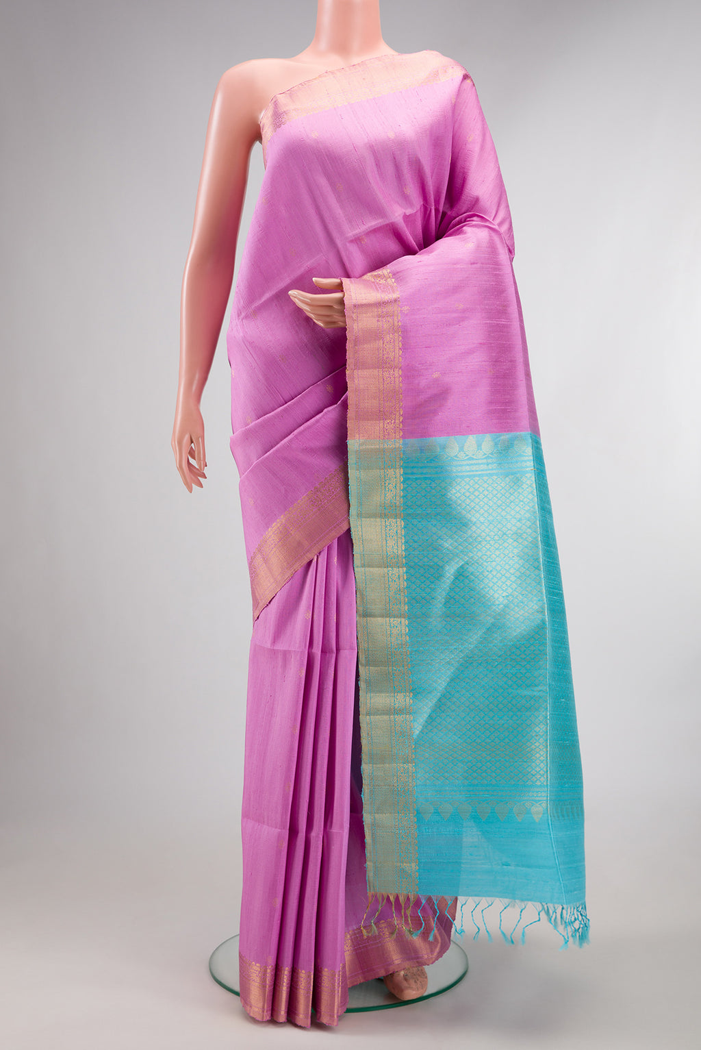 Lavender Dual Tone Raw Saree with Zari Butta on the body and Zari Border.  displayed on a mannequin