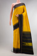 Pure Silk Yellow Kanjivaram Saree with Checked design on the body and Temple Border.  displayed on a mannequin