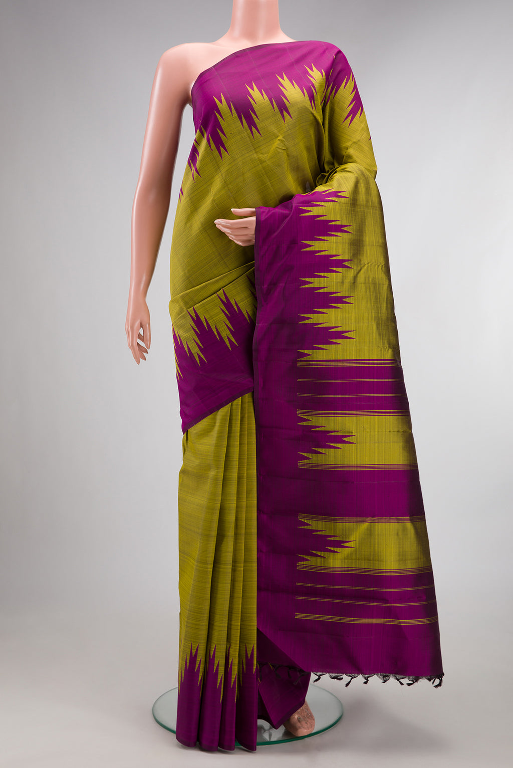Pure Silk Mehandi Green Dual Tone Kanjivaram Saree with Plain Body and Temple Border.  displayed on a mannequin
