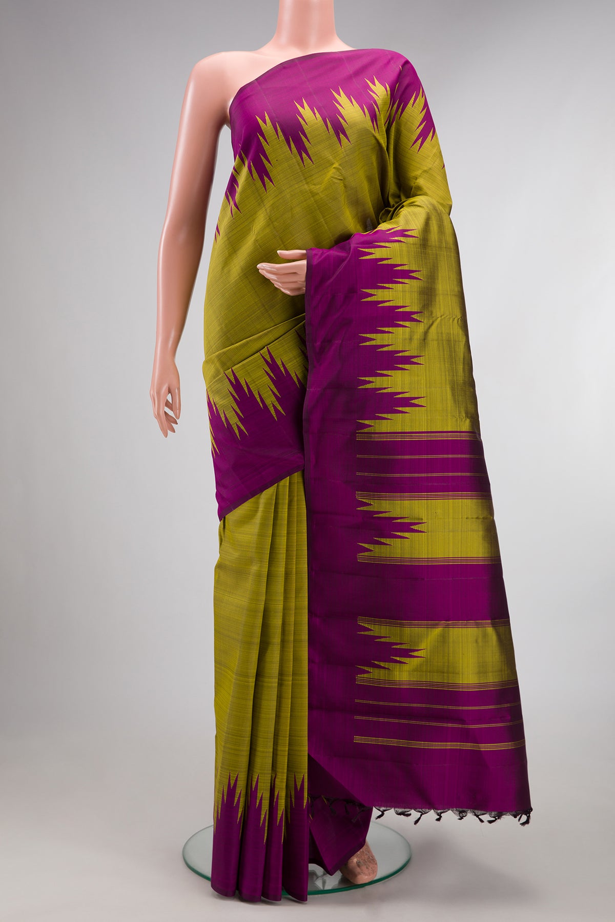 Pure Silk Mehandi Green Dual Tone Kanjivaram Saree with Plain Body and Temple Border.  displayed on a mannequin