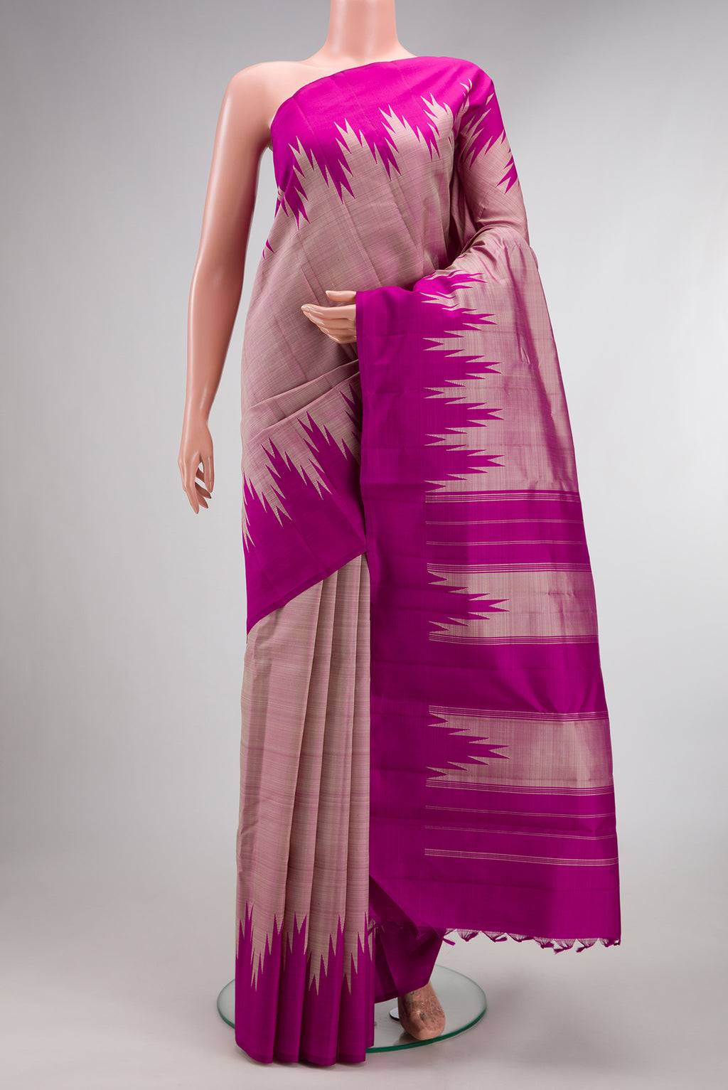 Pure Silk Pink Dual Tone Kanjivaram Saree with Plain Body and Rising Temple Border.  displayed on a mannequin