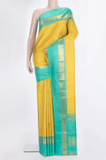 Pure Silk Yellow Kanjivaram Saree with Plain Body and Zari Border.  displayed on a mannequin