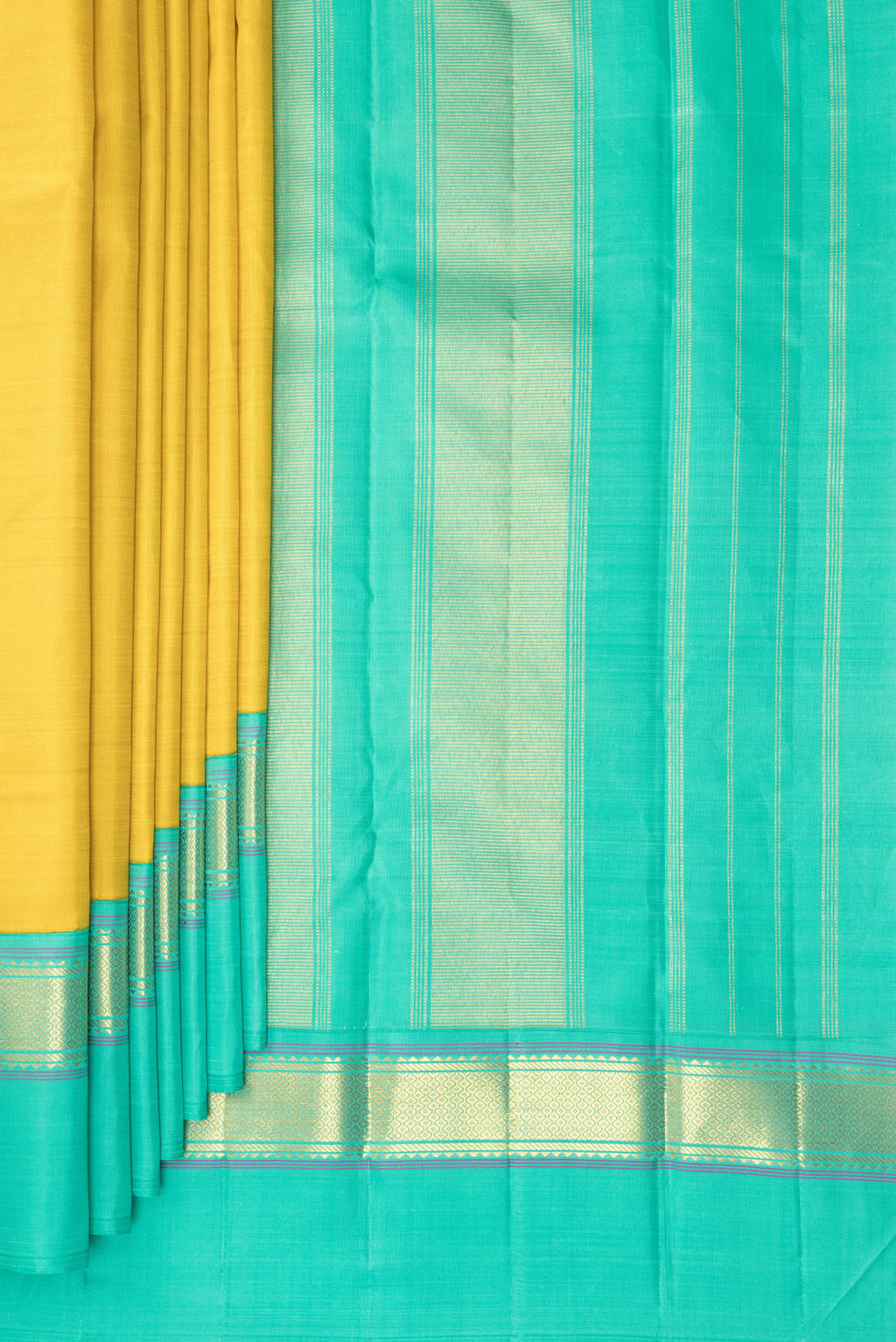 Pleats and pallu of Pure Silk Yellow Kanjivaram Saree with Plain Body and Zari Border. 