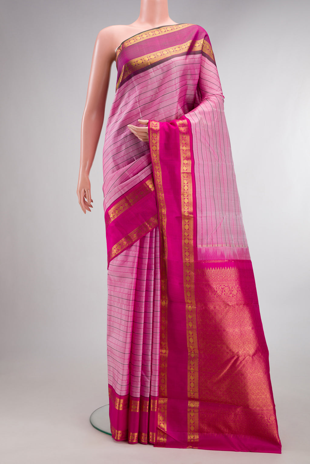 Pure Silk Pink Kanjivaram Saree with Veldhari on the body and Ganga Jamuna Border.  displayed on a mannequin