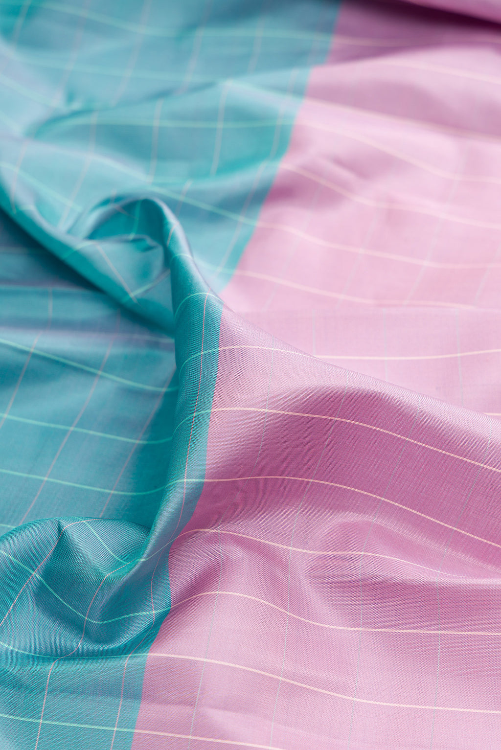 Close up of Pure Silk Multi Color Kanjivaram Saree with Checked design on the body and Fancy Border.  displaying folds