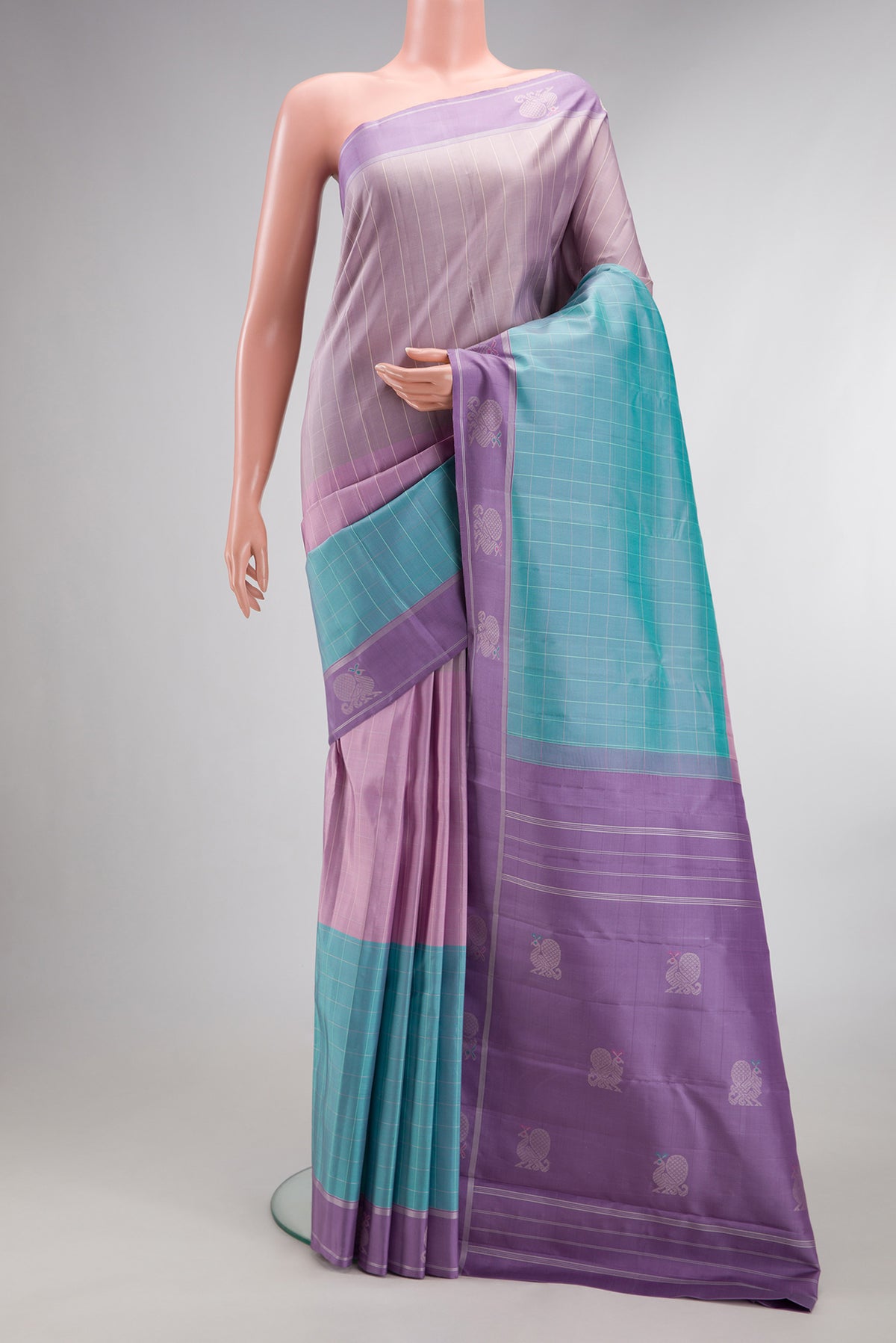 Pure Silk Multi Color Kanjivaram Saree with Checked design on the body and Fancy Border.  displayed on a mannequin