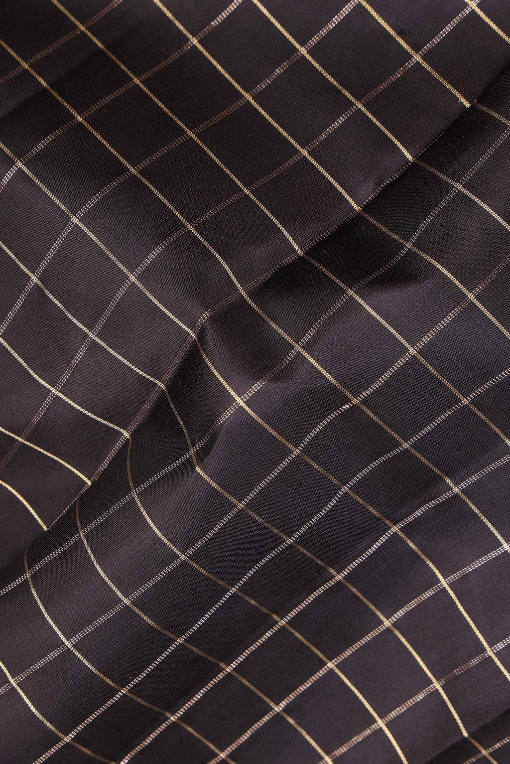 Close up of Pure Silk Black Kanjivaram Saree with Checked design on the body and Zari Border.  displaying folds