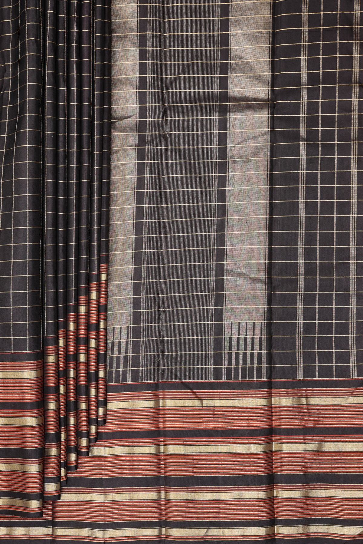 Pleats and pallu of Pure Silk Black Kanjivaram Saree with Checked design on the body and Zari Border. 