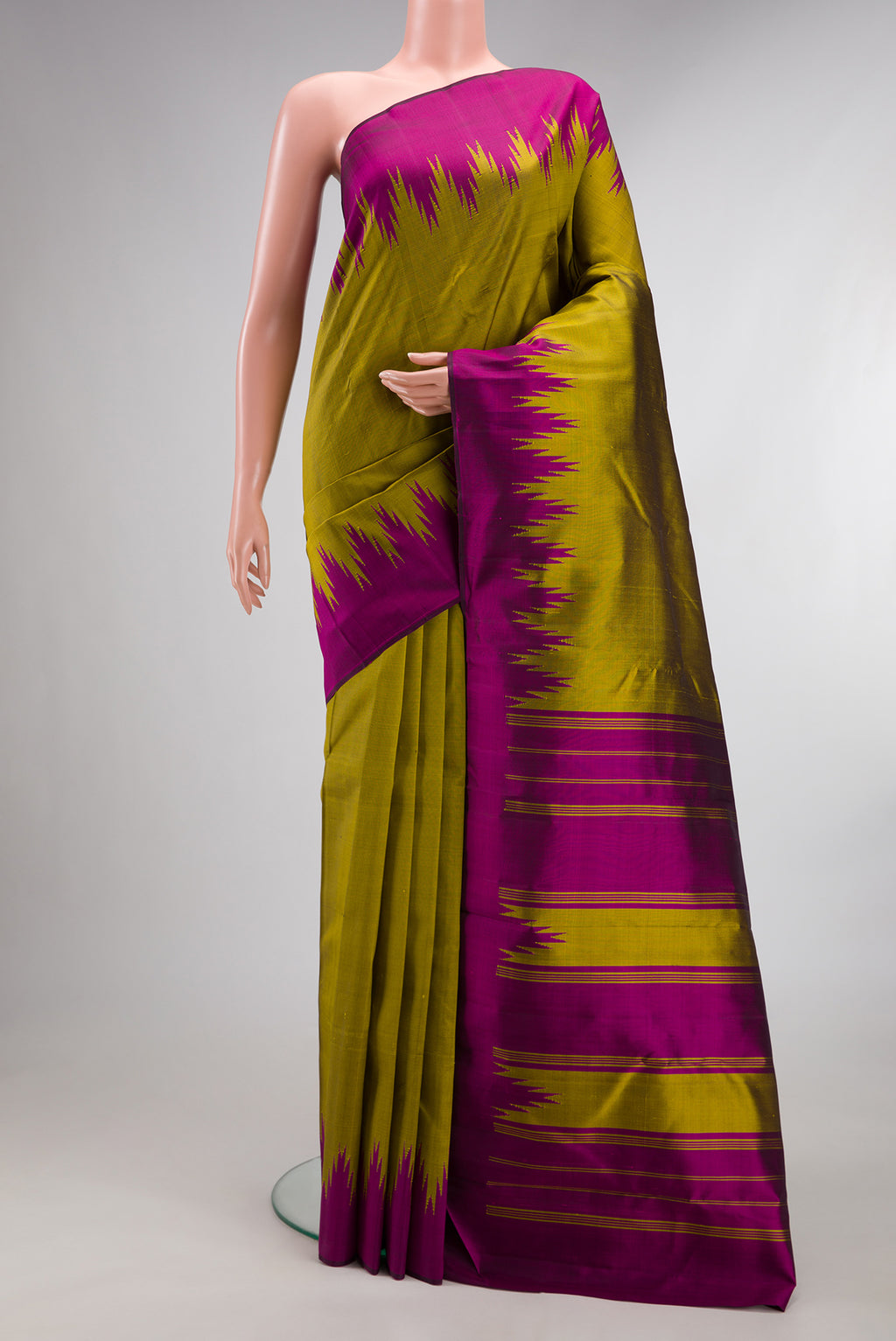 Pure Silk Mehandi Green Dual Tone Kanjivaram Saree with Plain Body and Temple Border.  displayed on a mannequin