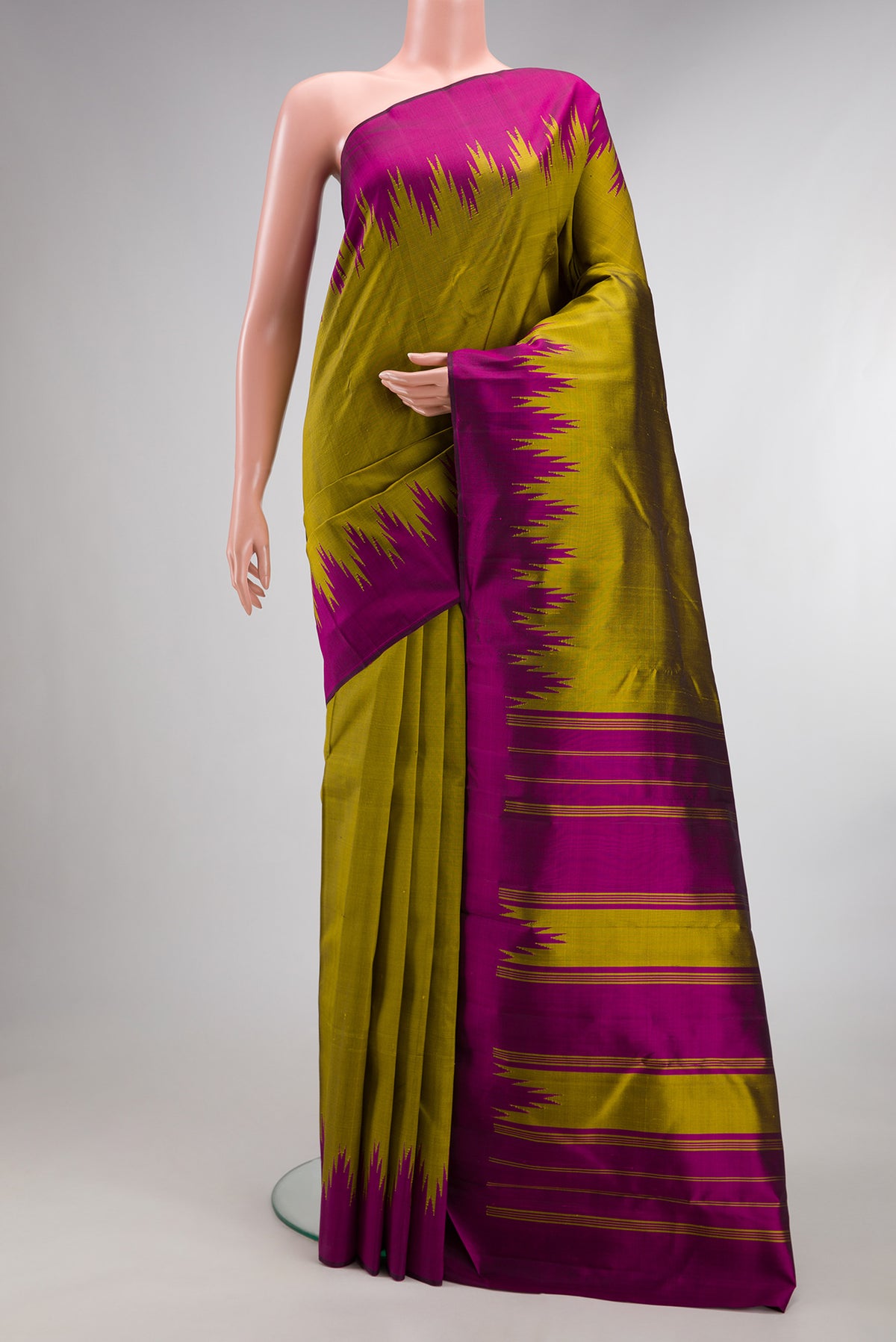 Pure Silk Mehandi Green Dual Tone Kanjivaram Saree with Plain Body and Temple Border.  displayed on a mannequin