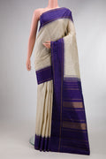 Pure Silk Pure Zari Beige Kanjivaram Saree with Checked design on the body and Temple Border.  displayed on a mannequin