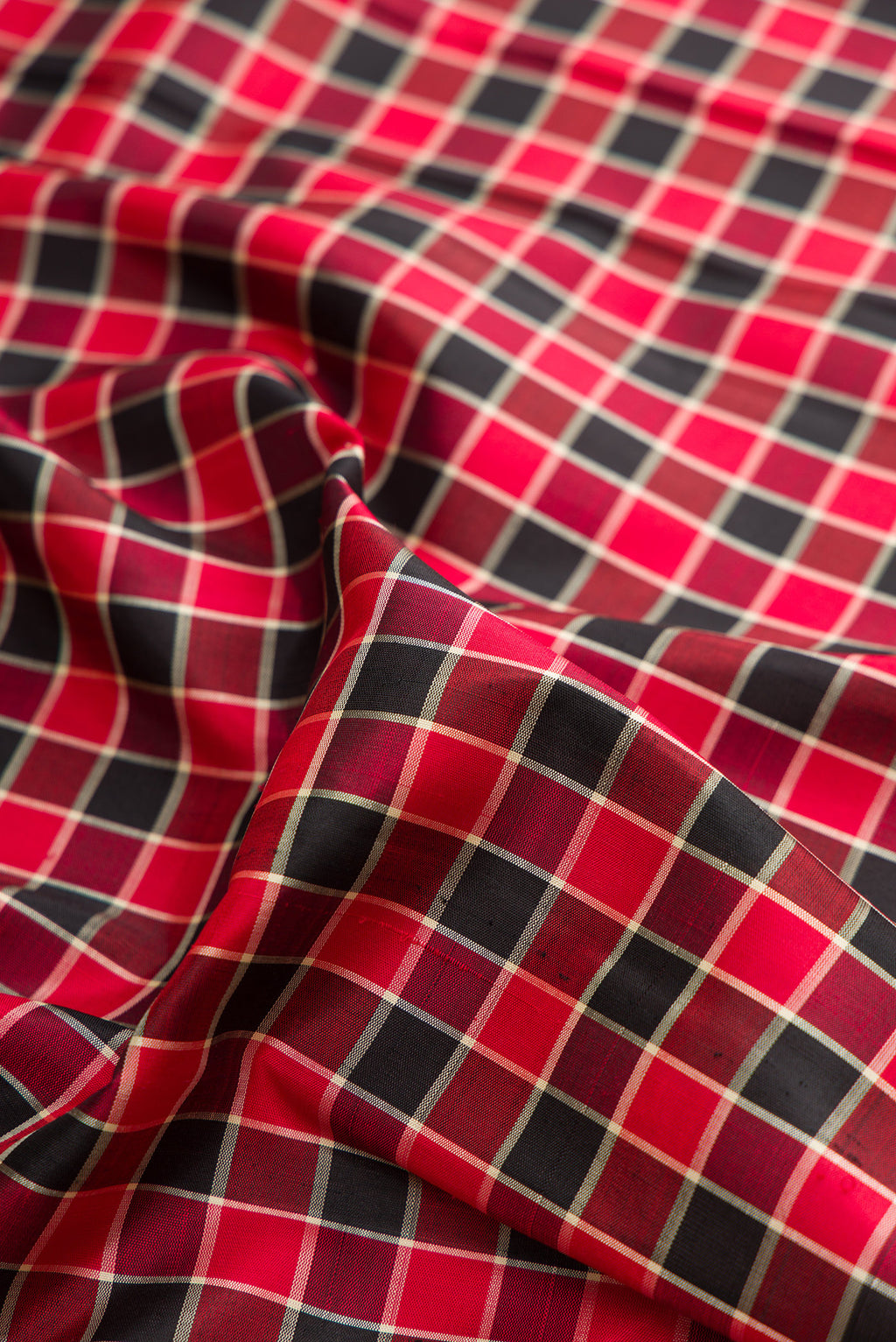 Close up of Pure Silk Pure Zari Multi Color Kanjivaram Saree with Checked design on the body and Zari Border.  displaying folds