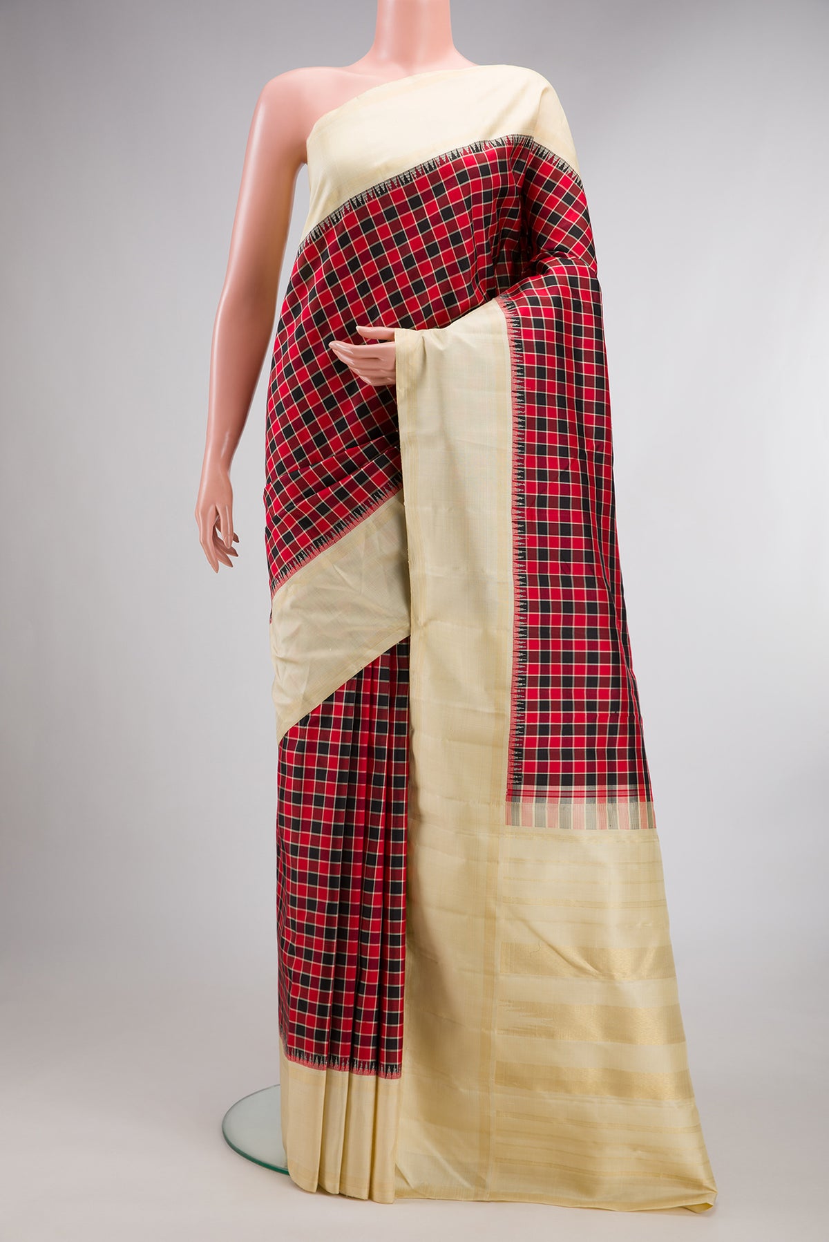 Pure Silk Pure Zari Multi Color Kanjivaram Saree with Checked design on the body and Zari Border.  displayed on a mannequin