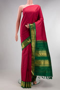Pure Silk Pure Zari Deep Red Kanjivaram Saree with Plain Body and One Side Border.  displayed on a mannequin