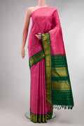 Pure Silk Pure Zari Pink Kanjivaram Saree with Zari Butta on the body and One Side Border.  displayed on a mannequin