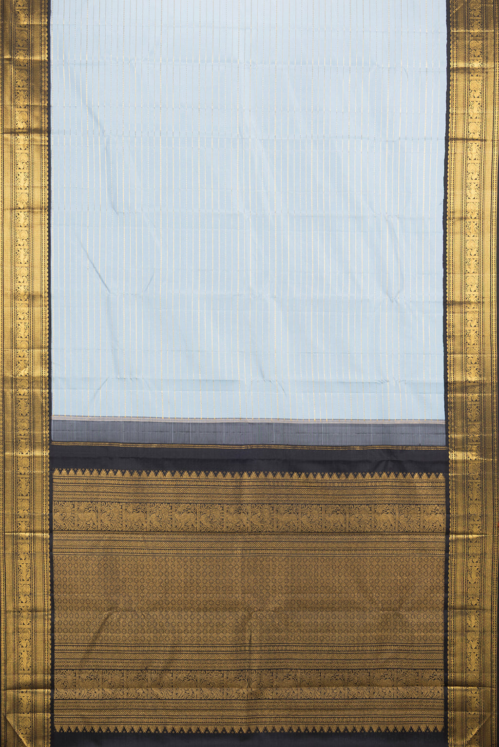 Flat view of Pure Silk Light Blue Kanjivaram Saree with Veldhari on the body and Zari Border. 