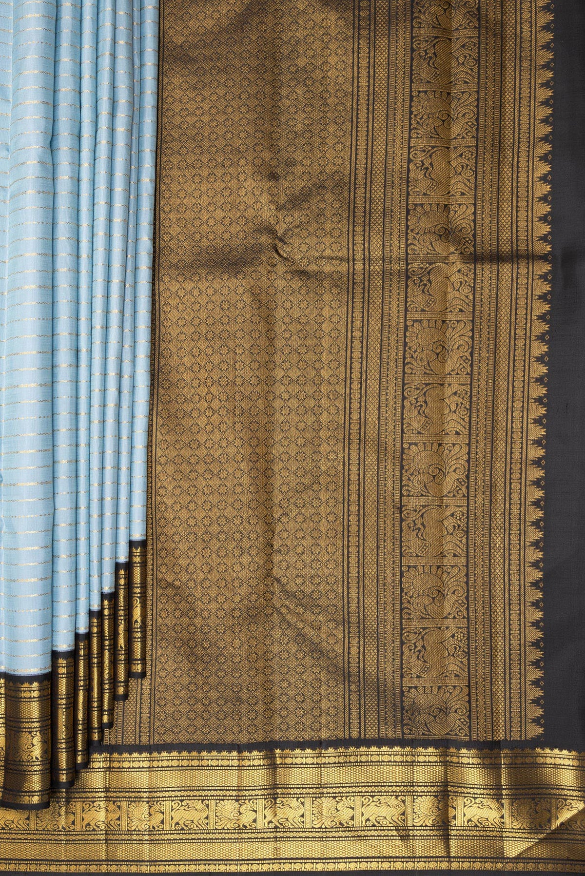 Pleats and pallu of Pure Silk Light Blue Kanjivaram Saree with Veldhari on the body and Zari Border. 