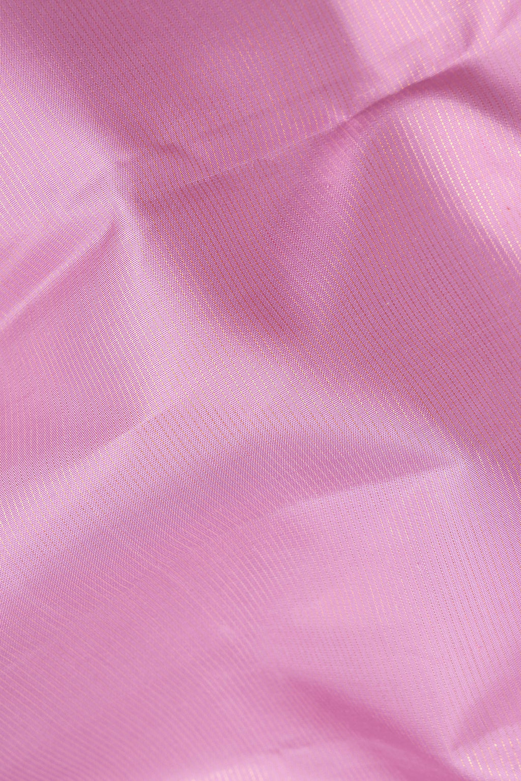 Close up of Pure Silk Pink Kanjivaram Saree with Stripes on the body and Zari Border.  displaying folds