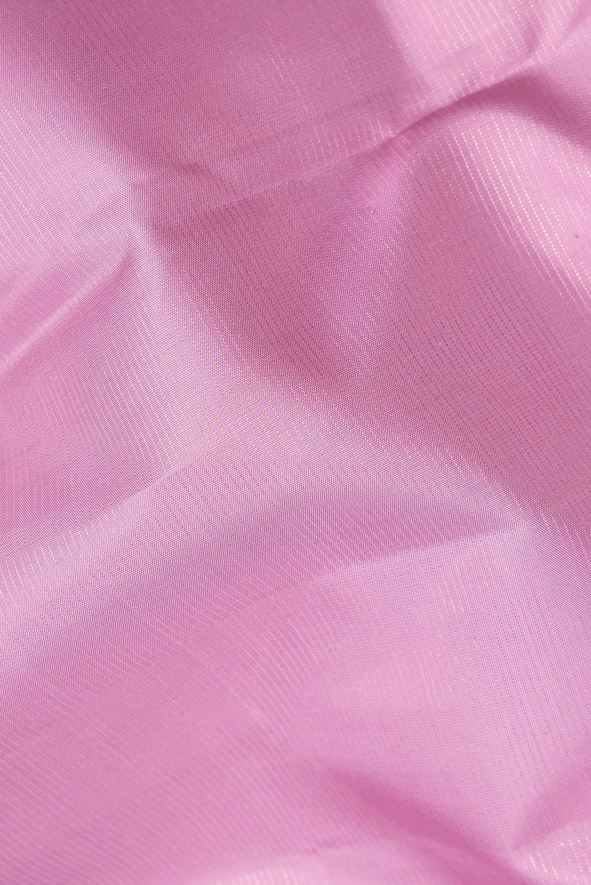 Close up of Pure Silk Pink Kanjivaram Saree with Stripes on the body and Zari Border.  displaying folds